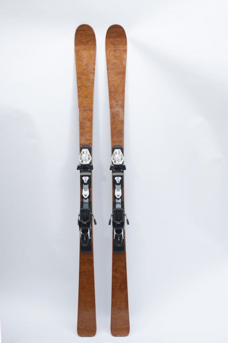 Figured cherry top sheet skis with bindings